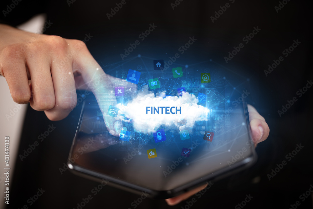 Businessman holding a foldable smartphone, technology concept Businessman holding a foldable smartphone, technology concept