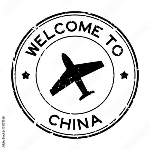 Grunge black welcome to China word with airplane icon round rubber seal stamp on white background