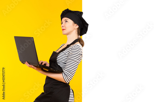 A female chef with a laptop...