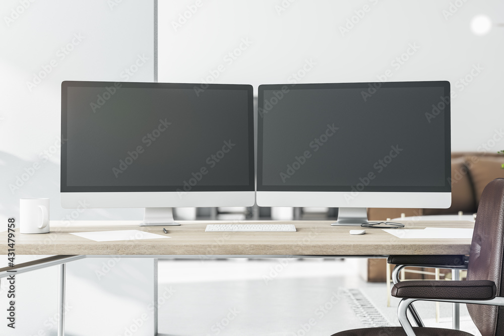 Stylish workspace with two black computer monitors with copyspace for your logo on wooden table in light sunny room. 3D rendering, mockup Stylish workspace with two black computer monitors with copyspace for your logo on wooden table in light sunny room. 3D rendering, mockup