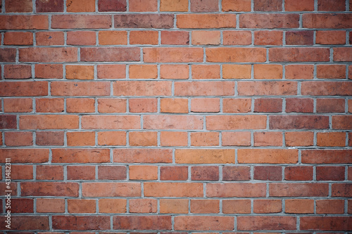 Brick brown wall of a Catholic church.