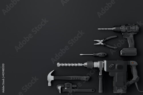 Fototapeta Naklejka Na Ścianę i Meble -  Top view of monochrome construction tools for repair and installation on black
