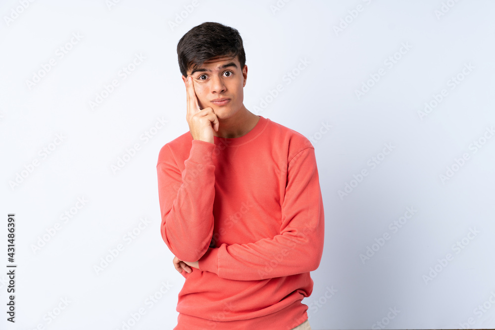 Handsome man over isolated blue background thinking an idea Handsome man over isolated blue background thinking an idea