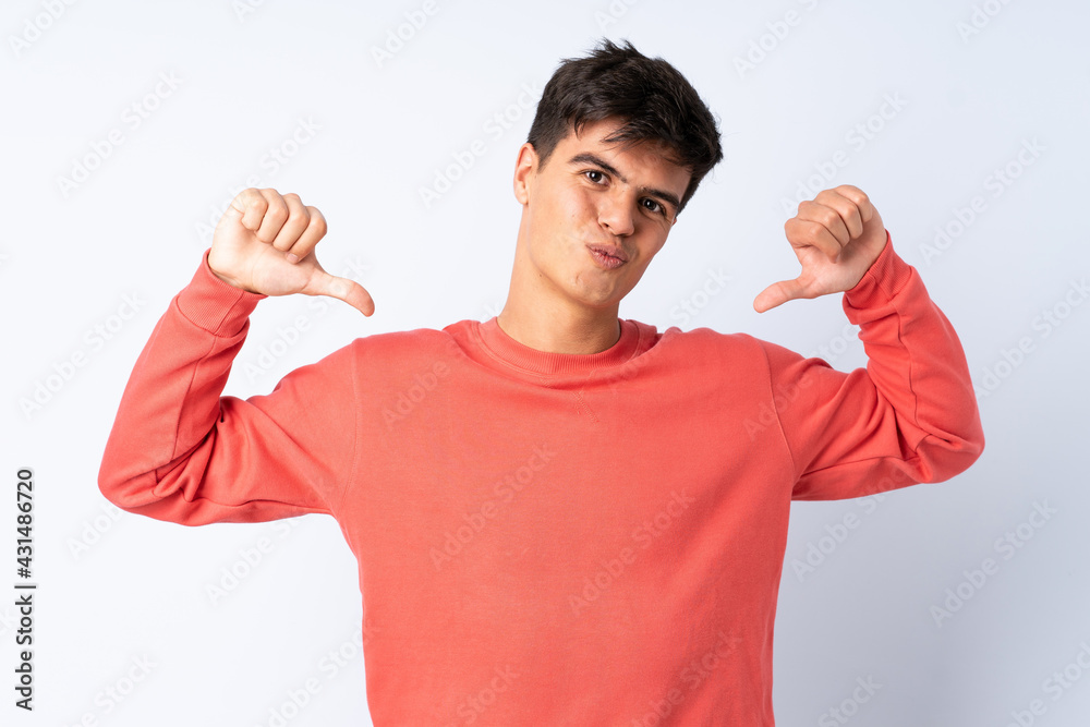 Handsome man over isolated blue background proud and self-satisfied Handsome man over isolated blue background proud and self-satisfied