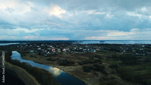 Top view of the blue river and swamp through the meadows