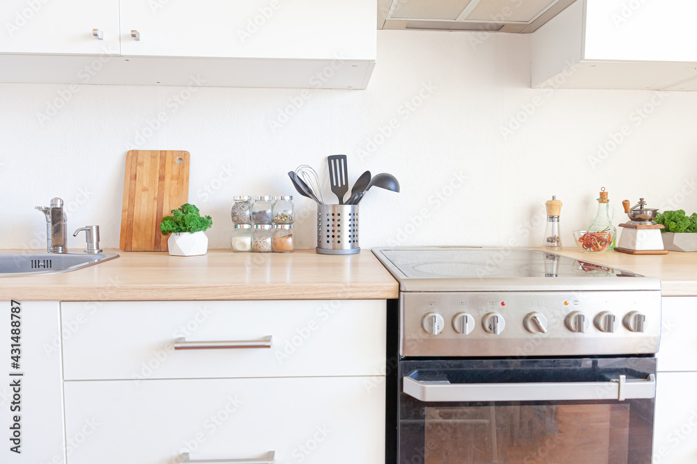 Scandinavian classic minimalistic kitchen with white and wooden details. Modern white kitchen clean contemporary style interior design. Scandinavian classic minimalistic kitchen with white and wooden details. Modern white kitchen clean contemporary style interior design.