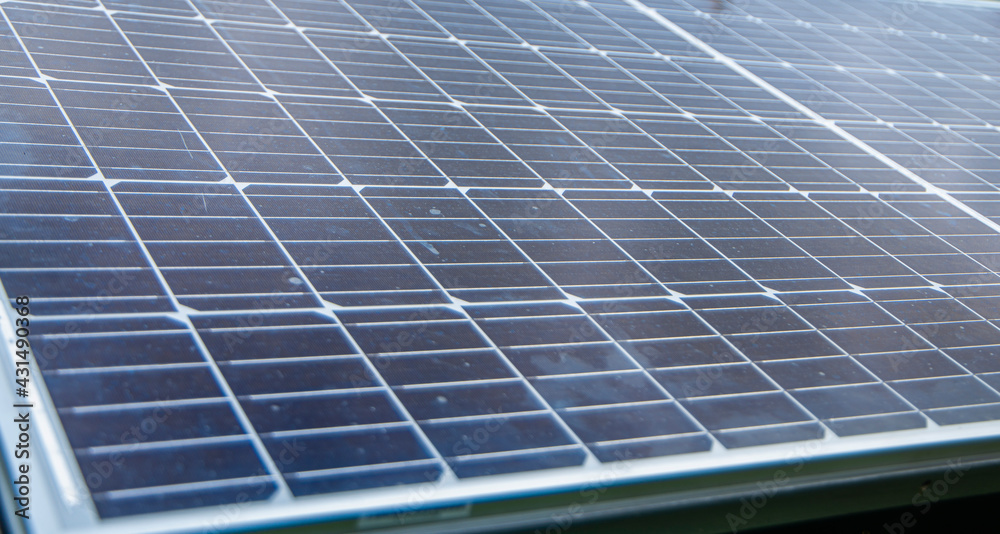 dirty and dusty solar panels in a city park, green energy and