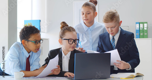 Young diverse businessmen at board meeting in office.