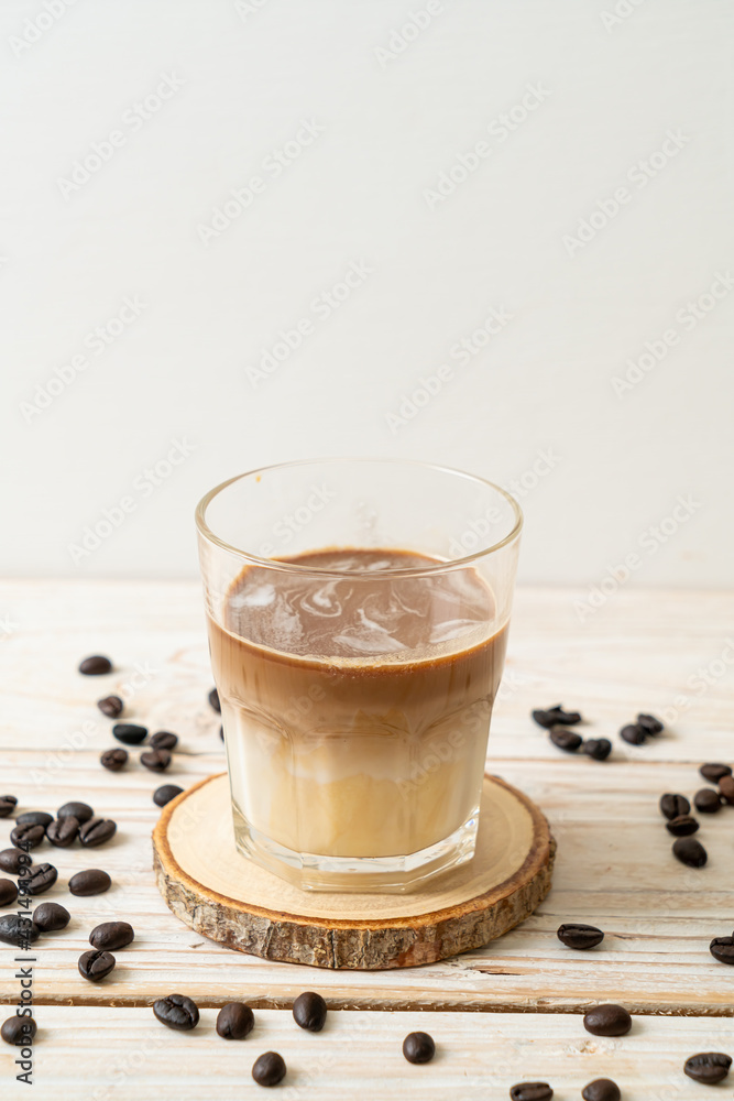 Dirty coffee, cold milk topped with hot espresso coffee shot Dirty coffee, cold milk topped with hot espresso coffee shot