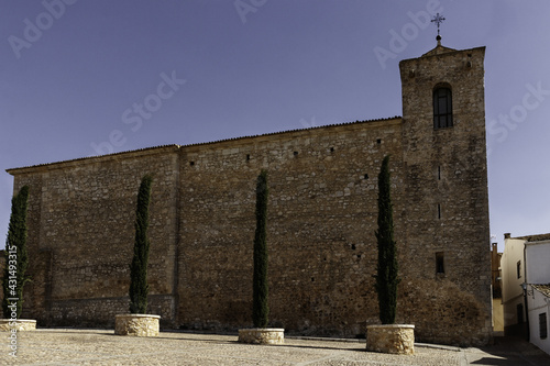Brick outer wall of Church of San Juan Bautista in the village of Alarcon, Cuenca, Spain photo
