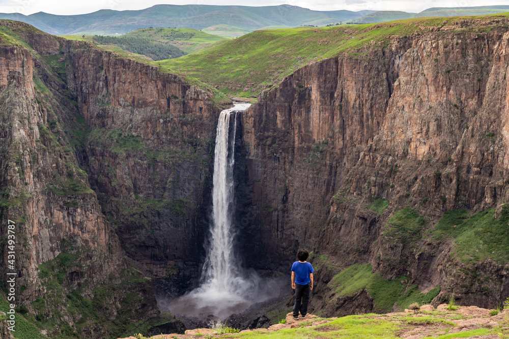 man looking at Maletsunyane Falls, Lesotho Africa