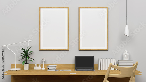 Two vertical frames mockup on the empty white wall with modern work desk interior. © Anees