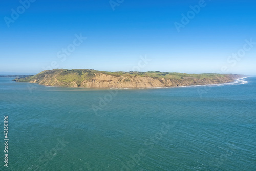 South Head of Manukau harbour entrance from Whatipu beach, Auckland, New Zealand © Emagnetic