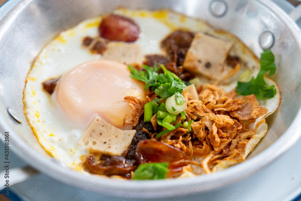 Pan Fried Egg topping with Thai sausage Pan Fried Egg topping with Thai sausage