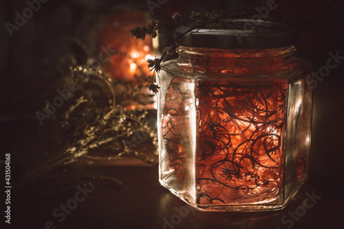 glass jar with dried flowers