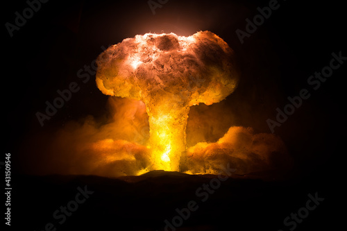 Nuclear war concept. Explosion of nuclear bomb. Creative artwork decoration in dark. photo