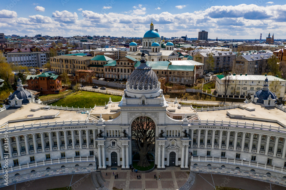 a panoramic view of the beautiful architectural buildings and solutions of the park and the Volga river in the old district of Kazan filmed from a drone 