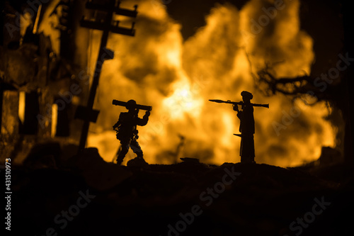 Military soldiers silhouettes with bazooka and rpg. War Concept. Military silhouettes fighting scene on war fog sky background, Mojahed with rpg and us soldier with bazooka at sunset.
