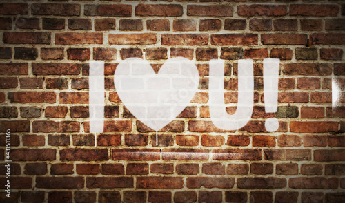 I love You sign spray painted on the brick wall