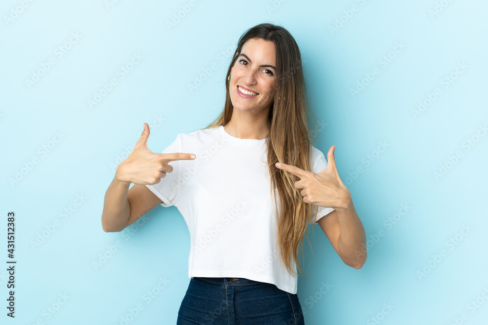 Young caucasian woman over isolated background proud and self-satisfied Young caucasian woman over isolated background proud and self-satisfied