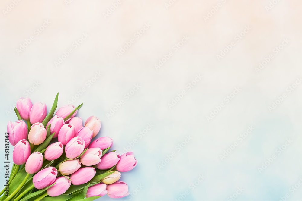 Fototapeta premium Bouquet of pink tulip flowers on a pastel background, selective focus. Mothers Day, bachelorette, birthday celebration concept