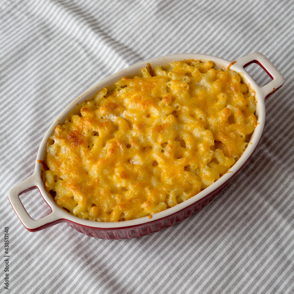 Homemade Macaroni and Cheese Pasta on cloth, low angle view. Homemade Macaroni and Cheese Pasta on cloth, low angle view.