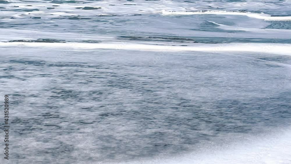 View of beautiful sea waves on the beach, Aerial view of ocean shoreline, deep blue ocean water and foamy waves View of beautiful sea waves on the beach, Aerial view of ocean shoreline, deep blue ocean water and foamy waves
