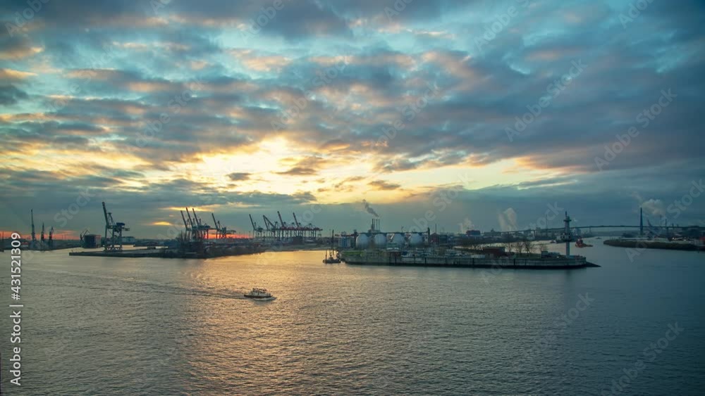 wonderful time lapse long shot of a sunrise in the port of Hamburg with ships and clouds wonderful time lapse long shot of a sunrise in the port of Hamburg with ships and clouds