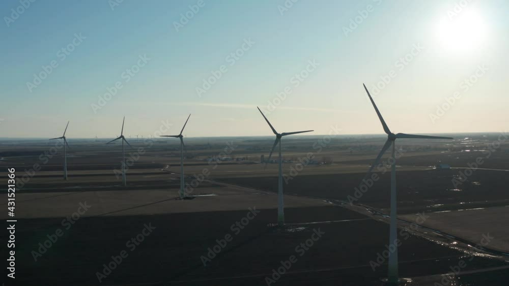 drone sidemove looking front of wind turbines in a field nice sun back drone sidemove looking front of wind turbines in a field nice sun back