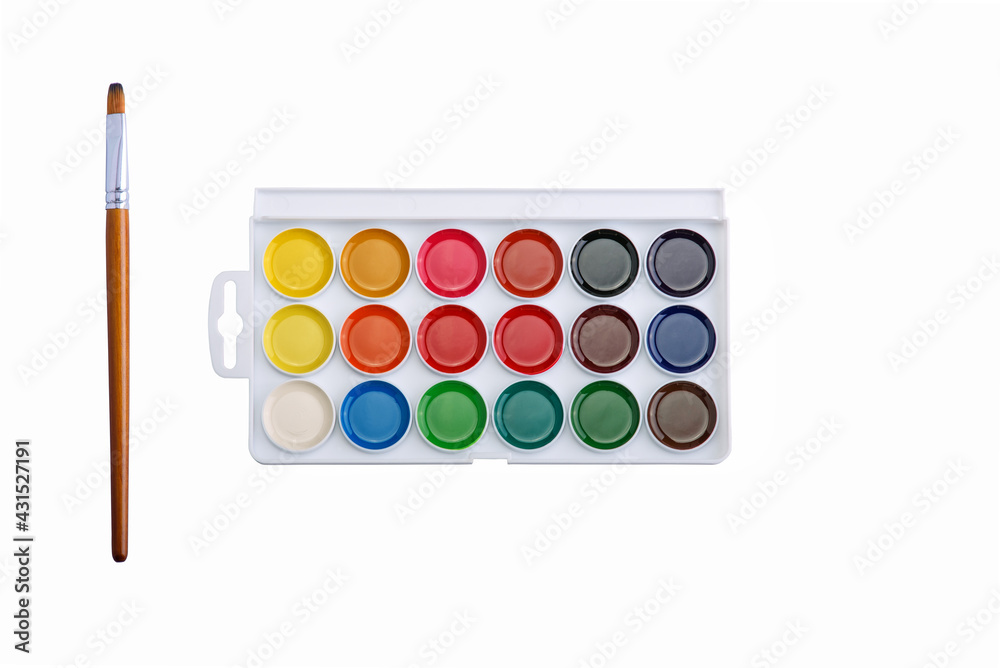 Multicolored aquarelle paints in paint box with brush on white background. Multicolored aquarelle paints in paint box with brush on white background.