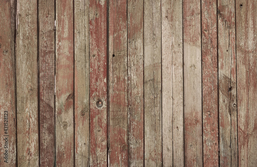 Red coated wood background. Cracked paint. Aged plank wood. Vertical boards covered with cracked paint