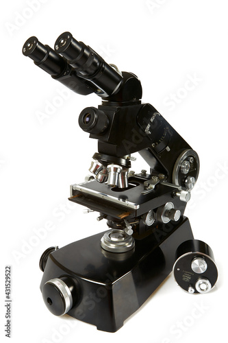 black vintage microscope isolated on white background © Diana Taliun