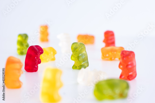 Group of mix colored gelatin candy gummy bears isolated on white background shallow depth of field