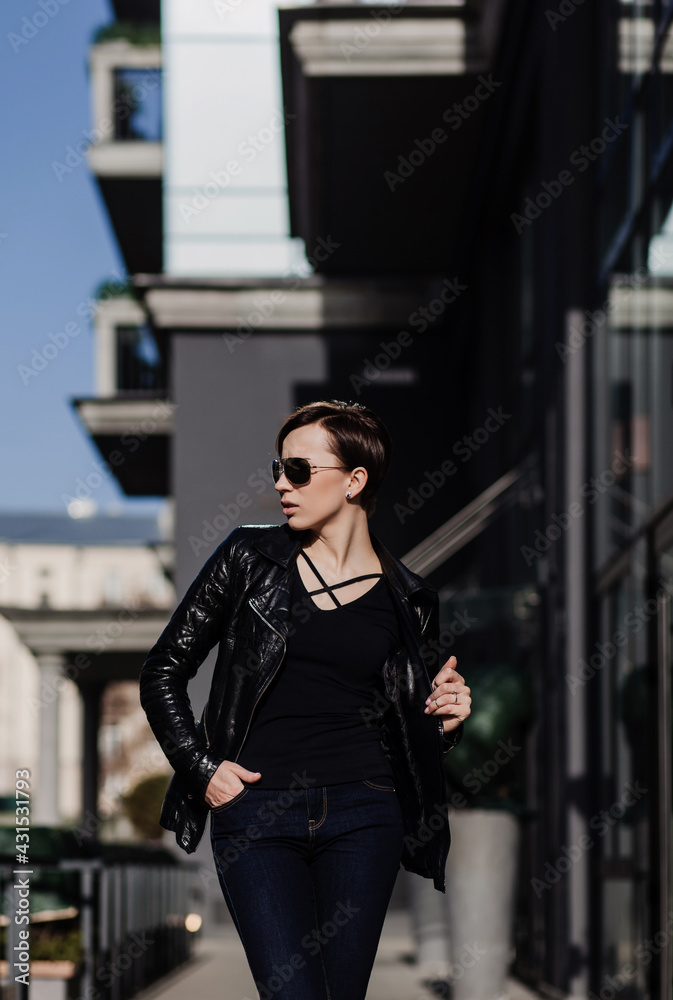 Fototapeta premium Fashion portrait of attractive woman in jeans