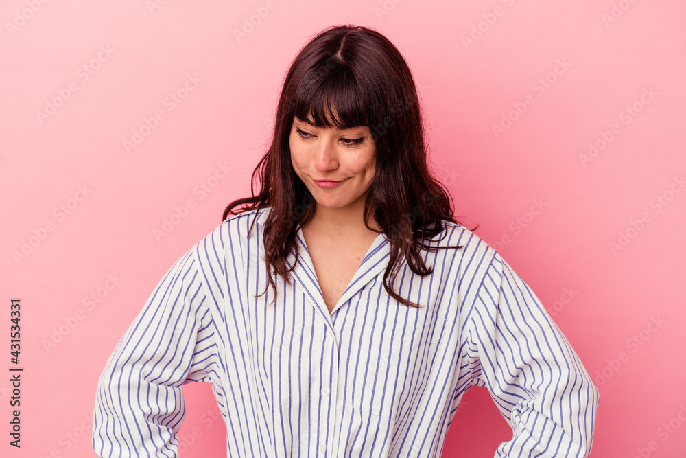 Fototapeta premium Young caucasian woman isolated on pink background dreaming of achieving goals and purposes