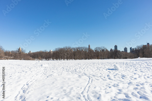 Sheep Meadow Covered in Snow at Central Park in New York City with no people during Winter