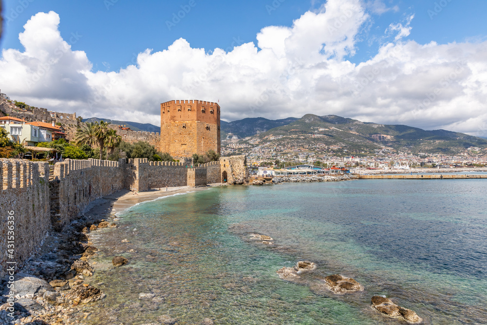 View of the historical Kizil Kule, Red Tower, in Alanya Castle during the coronavirus pandemic days in Alanya, Antalya, Turkey in 2021.