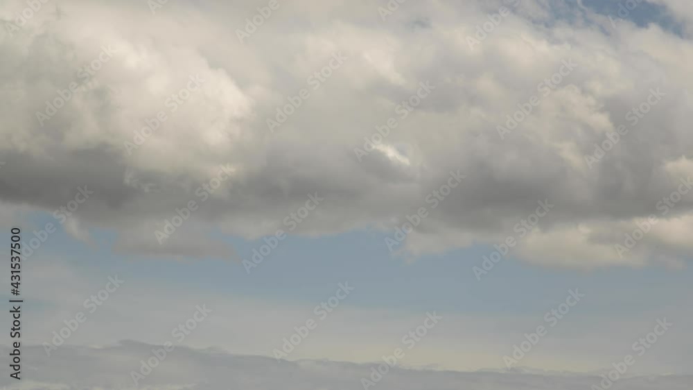 Timelapse sky fluffy white clouds. slow moving clouds on a blue background. Video Background of the movement of air masses across the sky. Universal b-roll Timelapse sky fluffy white clouds. slow moving clouds on a blue background. Video Background of the movement of air masses across the sky. Universal b-roll