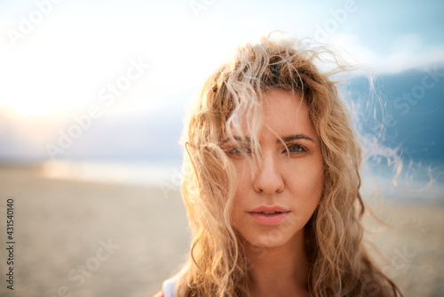 BEAUTIFUL NATURAL GIRL BY THE SEA, BOKEH PORTRAIT, SUNSET ON THE BEACH