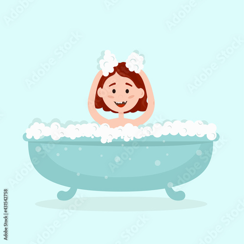a little happy girl bathing in a bathtub with bubbles
