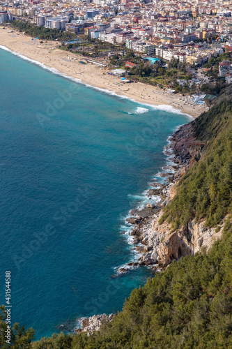Fototapeta Naklejka Na Ścianę i Meble -  High angle aerial view of Cleopatra Beach during the coronavirus pandemic days in Alanya, Antalya, Turkey in 2021.