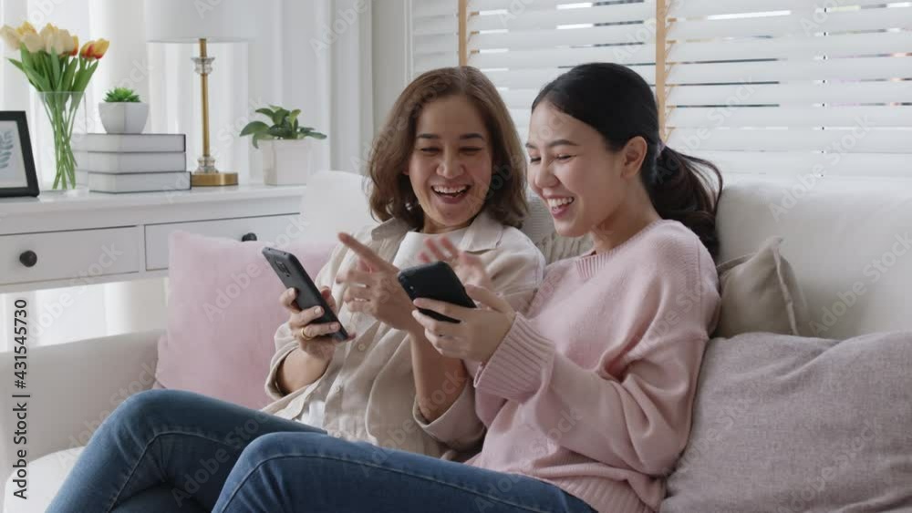 Attractive beautiful asian family sit sofa couch living room enjoy urban life joyful promotion discount shop buy health care insurance online quarantine activity isolate omnichannel experience at home Attractive beautiful asian family sit sofa couch living room enjoy urban life joyful promotion discount shop buy health care insurance online quarantine activity isolate omnichannel experience at home