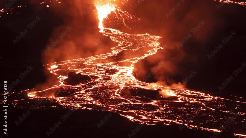 eruption and river of flowing lava at night Iceland time lapse