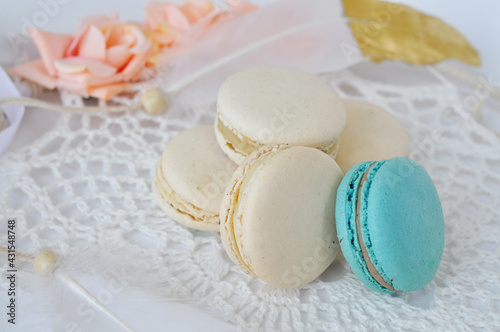 french tasty macaroons on a white lace
