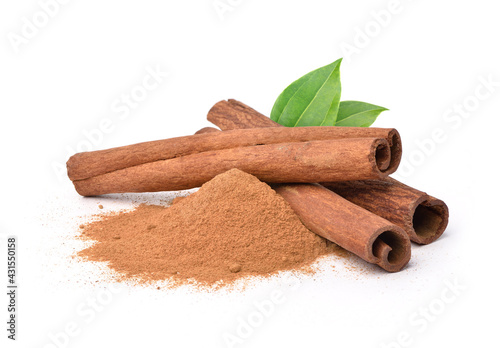 Tableau sur toile Aromatic cinnamon powder with sticks on white background.