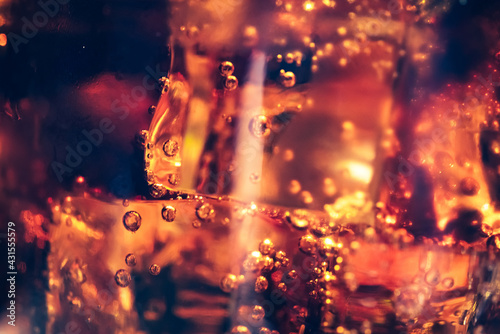 Refreshing Bubbly Soda Pop with Ice Cubes. Cold soda iced drink in a glasses - Selective focus, shallow DOF