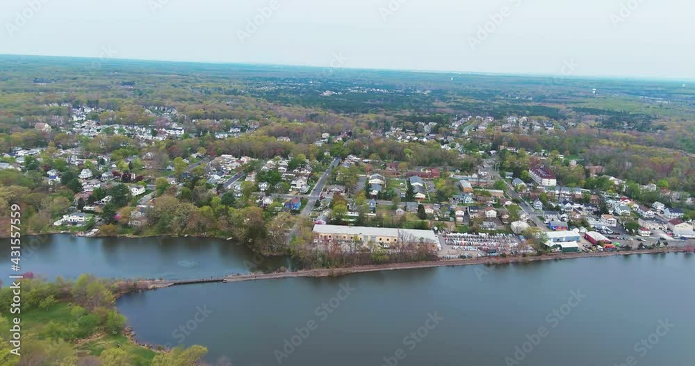 Aerial top view waterfront suburban street of middle class suburban neighborhood with houses Aerial top view waterfront suburban street of middle class suburban neighborhood with houses