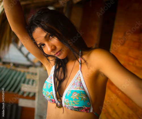 Young latina woman in a hut on the beach
