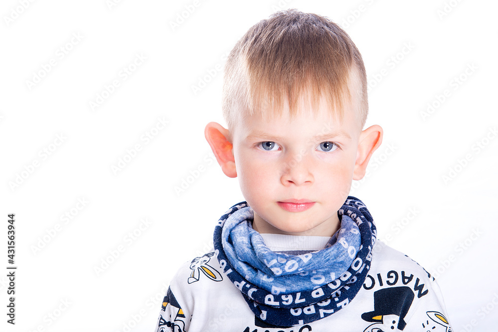 Close-up portrait of cute serious little boy face with blue eyes and big ears isolated on white background Close-up portrait of cute serious little boy face with blue eyes and big ears isolated on white background