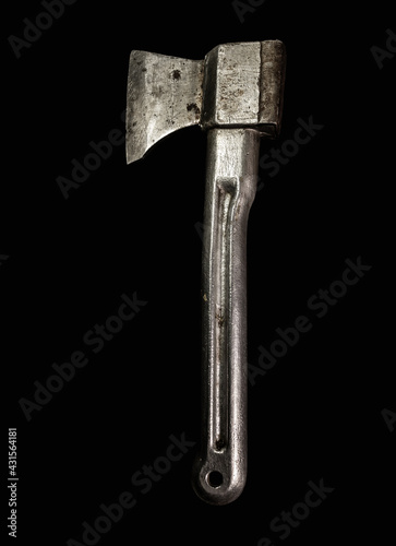 Old silver ax with a metal handle. Isolated on black background